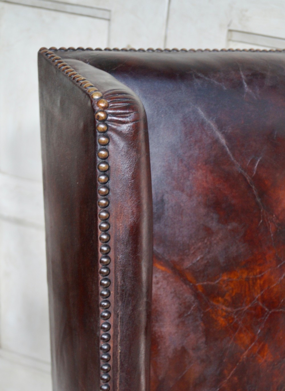 A Victorian library chair featuring dark brown aged leather upholstery with studding detail and a solid oak frame with turned front legs. View IV