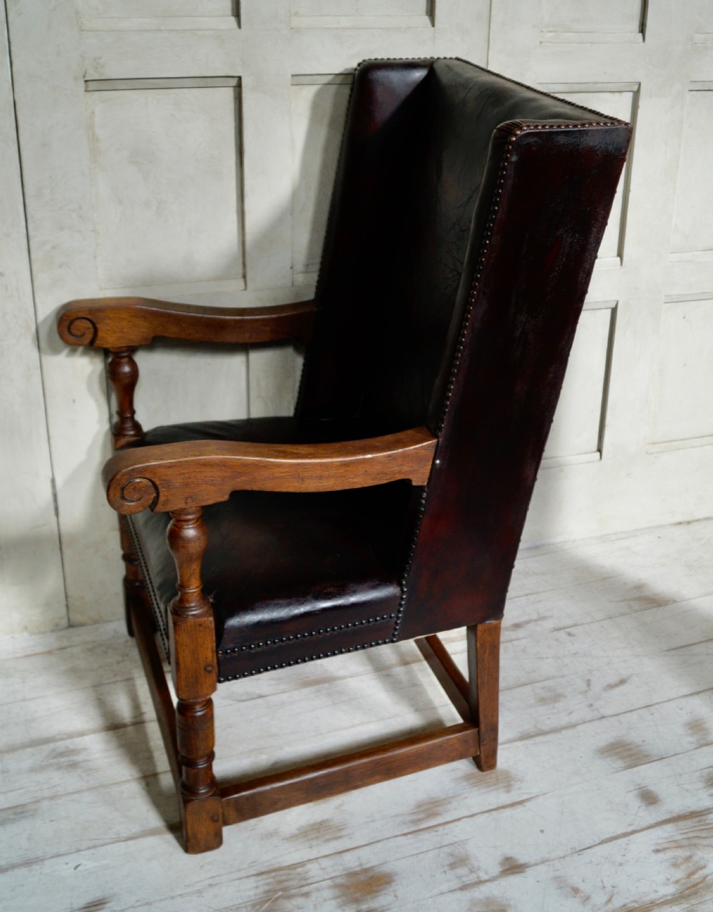 A Victorian library chair featuring dark brown aged leather upholstery with studding detail and a solid oak frame with turned front legs. View IX