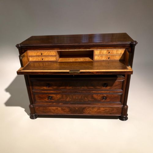 fig 1. A French rosewood commode with four wide drawers, turned wooden knobs, and a dark polished grain finish.