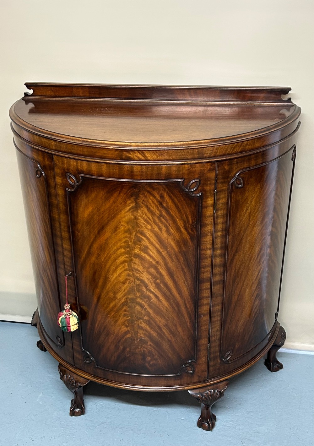 Mahogany Demi Lune side cabinet 
