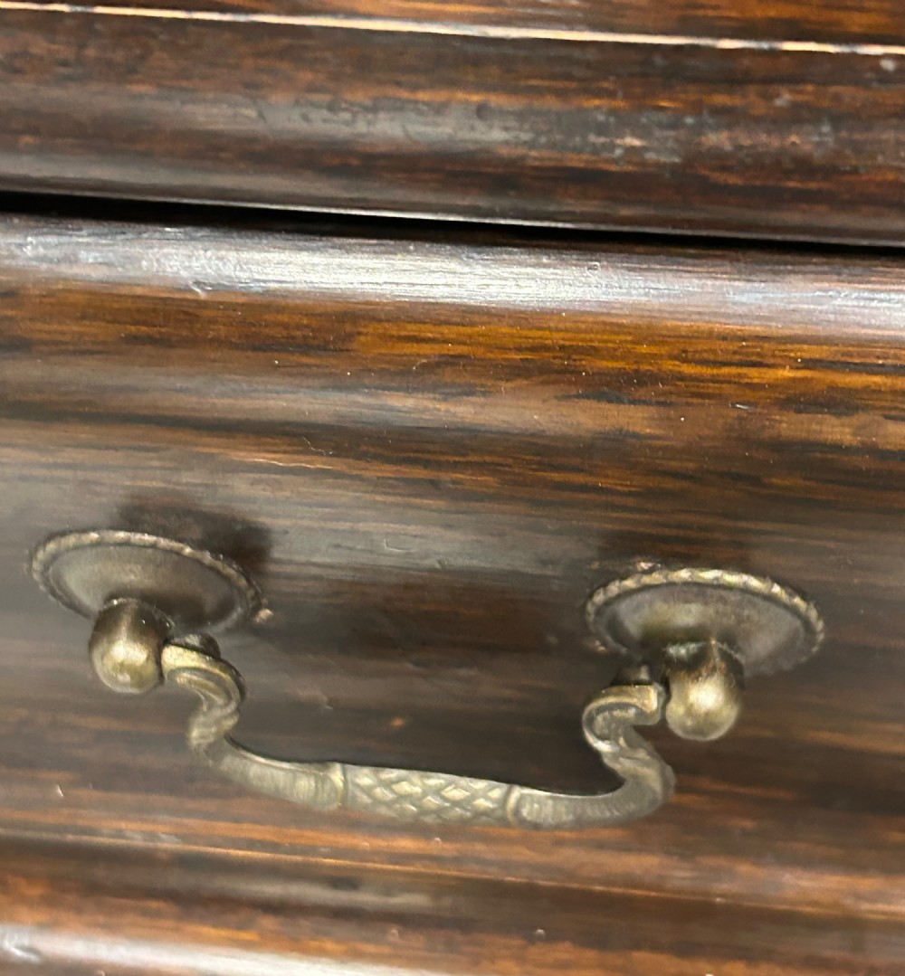 A pair of dark oak Globe Wernicke sectional bookcases featuring four leaded glass door compartments and a base drawer each. View XI