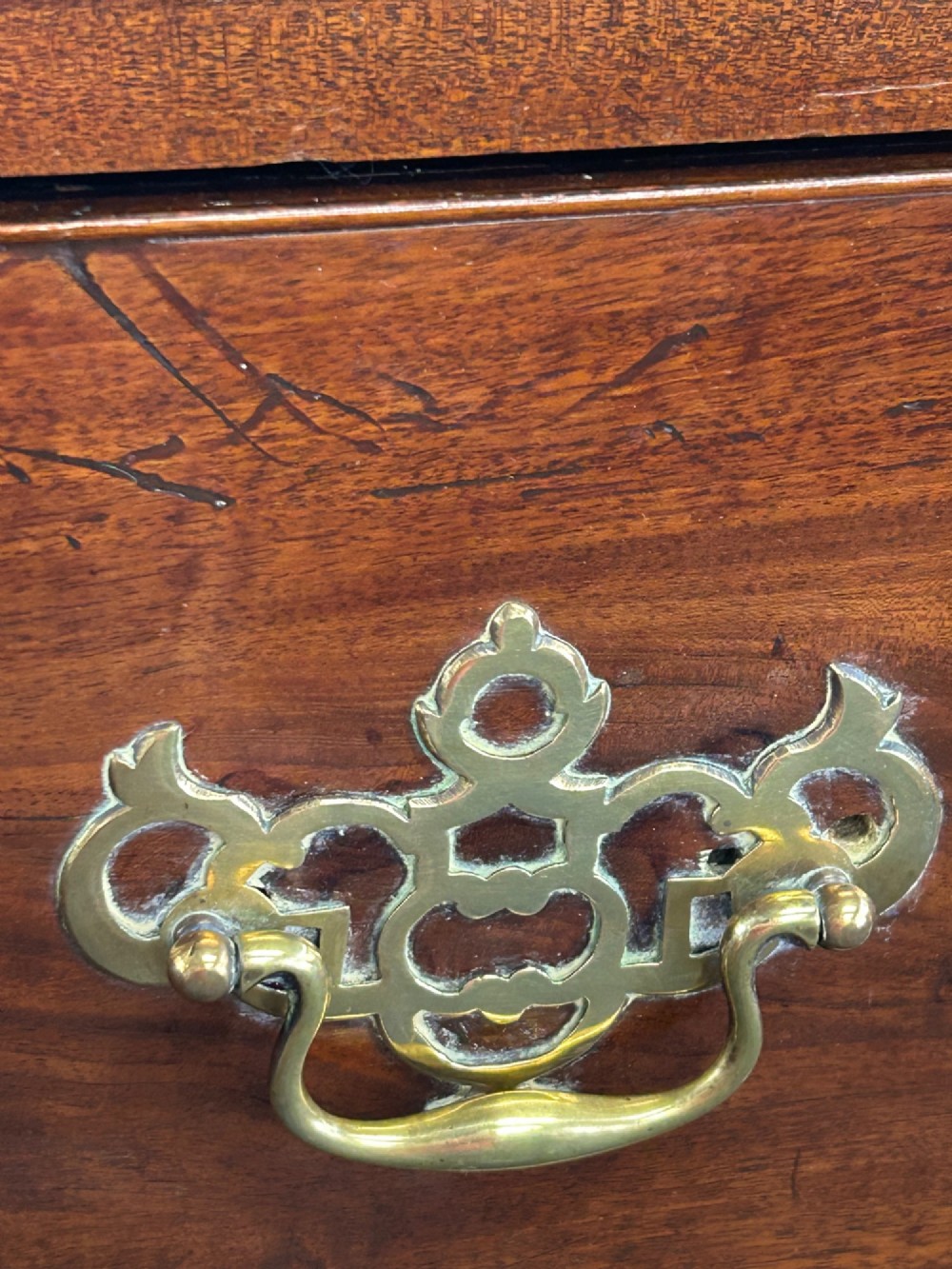 A tall Georgian mahogany chest on chest featuring eight drawers with brass swan-neck handles, blind fretwork frieze, and bracket feet. View VIII
