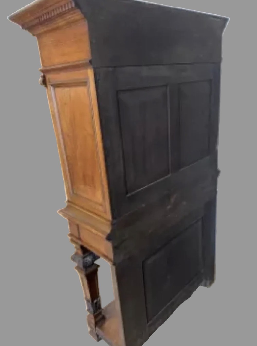 A 19th-century Renaissance Revival carved wood cabinet-on-stand with intricate relief carvings, twin doors, upper drawers, and an open lower shelf. View IV