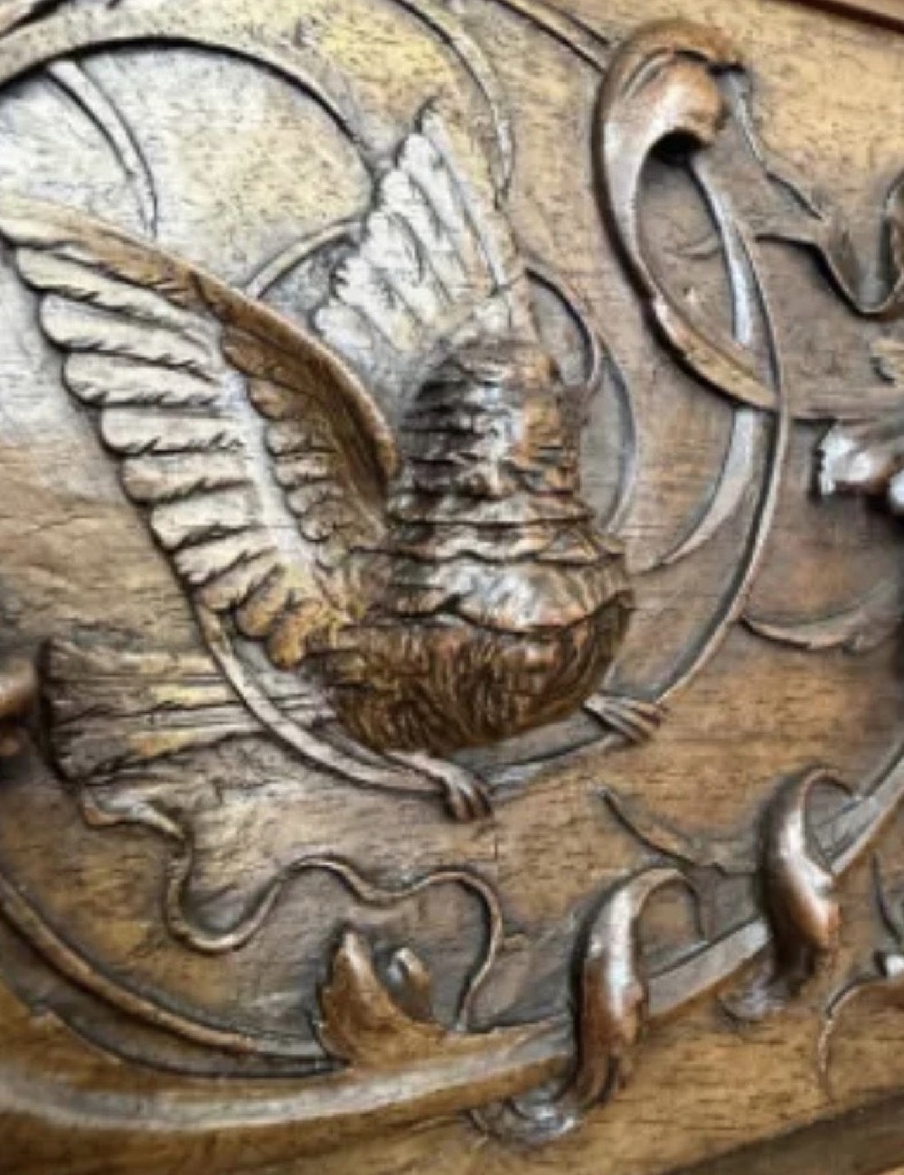 A 19th-century Renaissance Revival carved wood cabinet-on-stand with intricate relief carvings, twin doors, upper drawers, and an open lower shelf. View VI