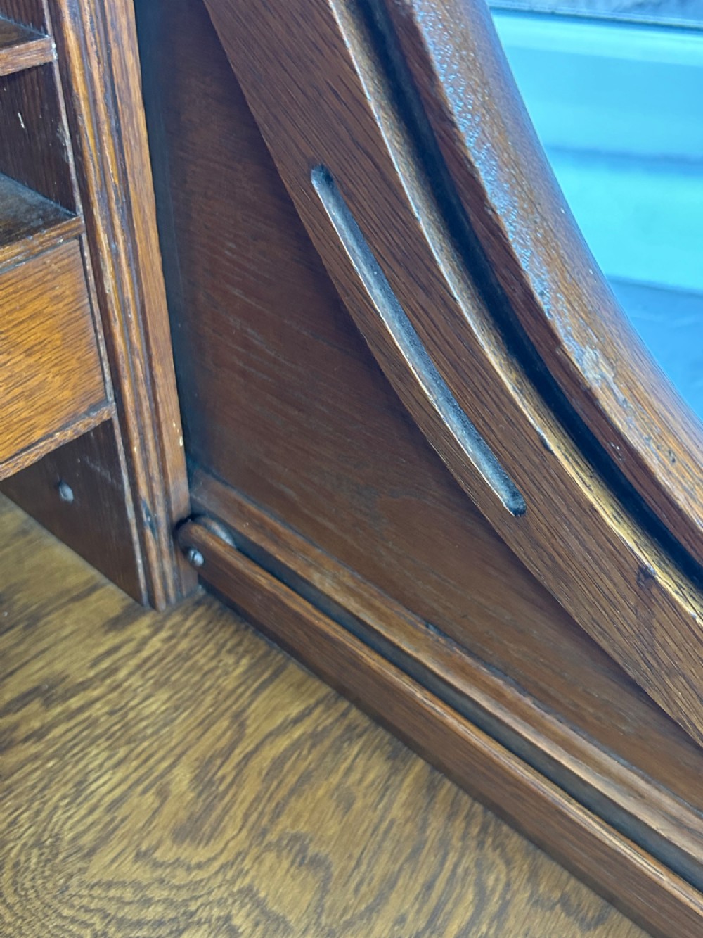 A warm brown oak roll top desk featuring a tambour slatted shutter top, central drawers, and twin pedestals with integrated storage drawers. View X