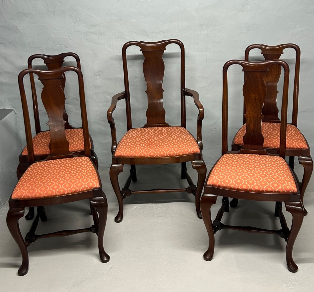 A set of five dark mahogany Queen Anne style dining chairs featuring vase-shaped splat backs, cabriole legs, and patterned terracotta fabric seats. View II