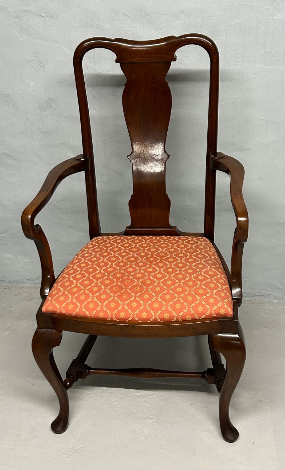 A set of five dark mahogany Queen Anne style dining chairs featuring vase-shaped splat backs, cabriole legs, and patterned terracotta fabric seats. View III
