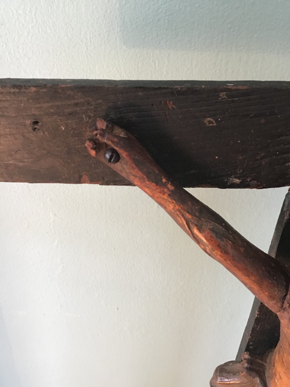 A hand-carved wooden standing crucifix featuring a detailed Corpus Christi figure mounted on a dark ebonised wooden cross with a tiered base. View V