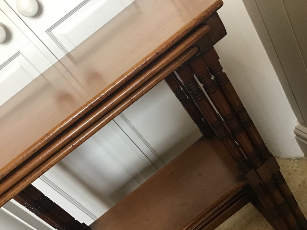 Aesthetic movement nest of three walnut tables  View III