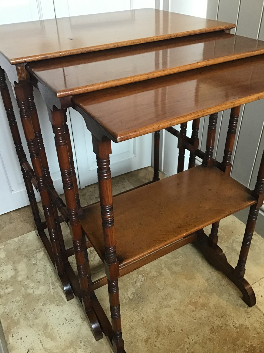 Aesthetic movement nest of three walnut tables  View VII