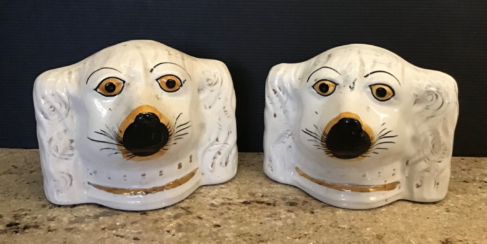 Pair of Staffordshire Spaniel Head money boxes 