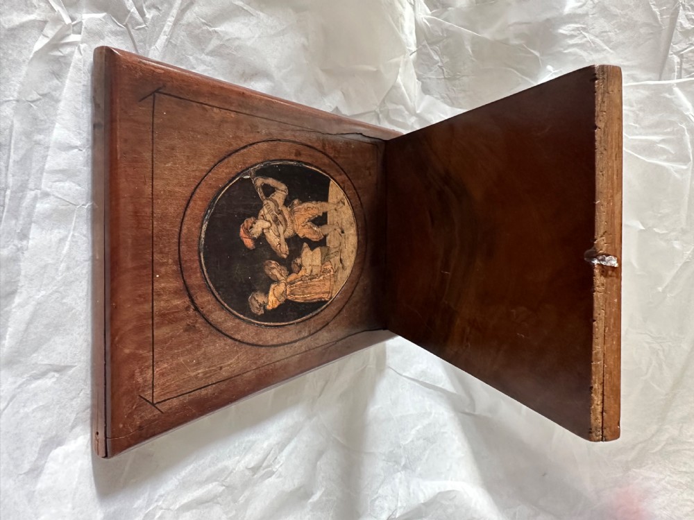 A rectangular olive wood folding travel mirror featuring a central oval marquetry panel with inlaid figures and Sorrento lettering. View VI