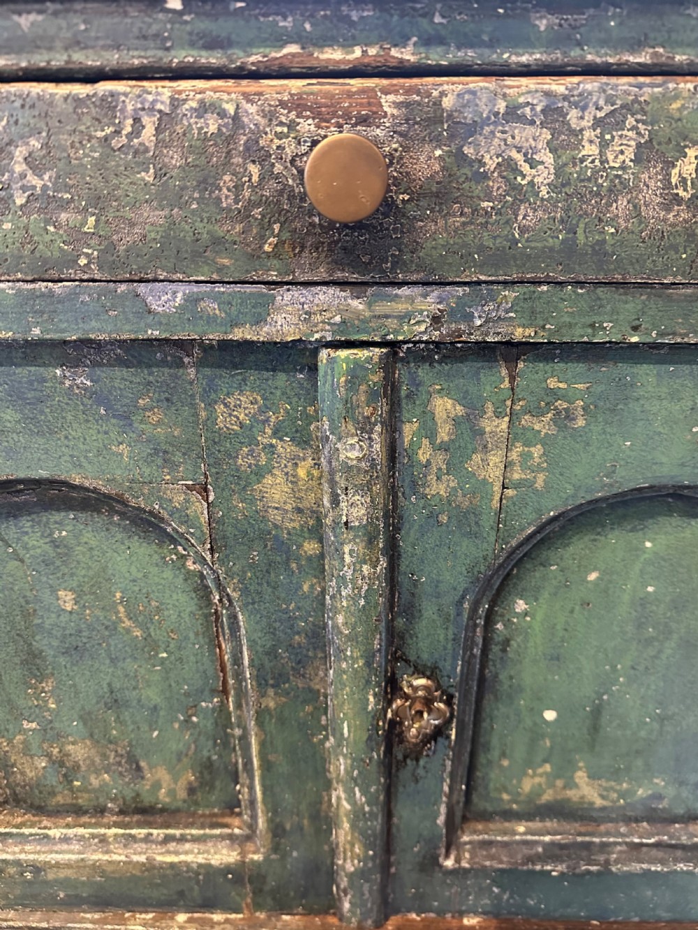 An antique French dark green painted miniature dresser featuring a tiered spindle plate rack above a single drawer and twin arched panel cupboard doors. View IV