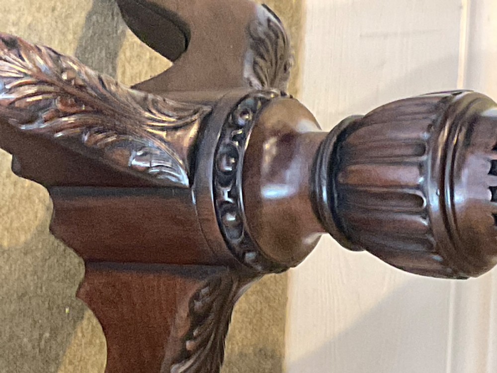 A nineteenth-century mahogany tripod table featuring a scalloped piecrust top, a fluted column, and carved cabriole legs terminating in claw feet. View III