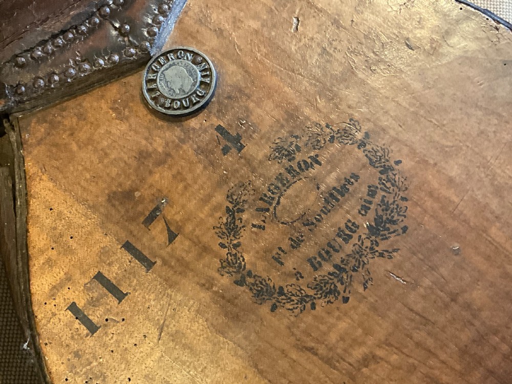 Antique French wooden fireplace bellows featuring dark leather trim, metal nozzle, and maker stamp printed on the wooden body. View VIII