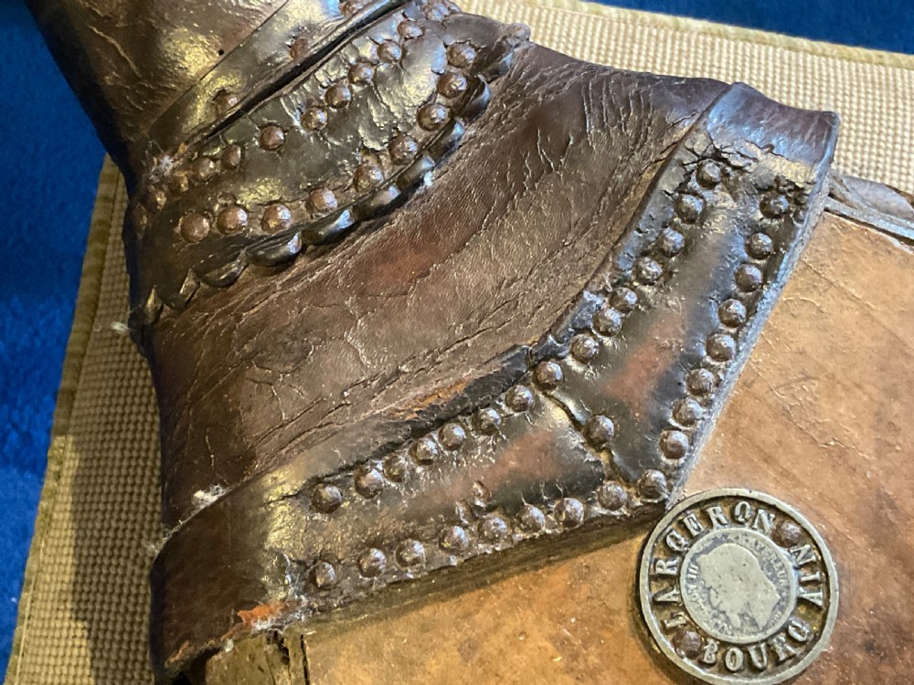 Antique French wooden fireplace bellows featuring dark leather trim, metal nozzle, and maker stamp printed on the wooden body. View IX