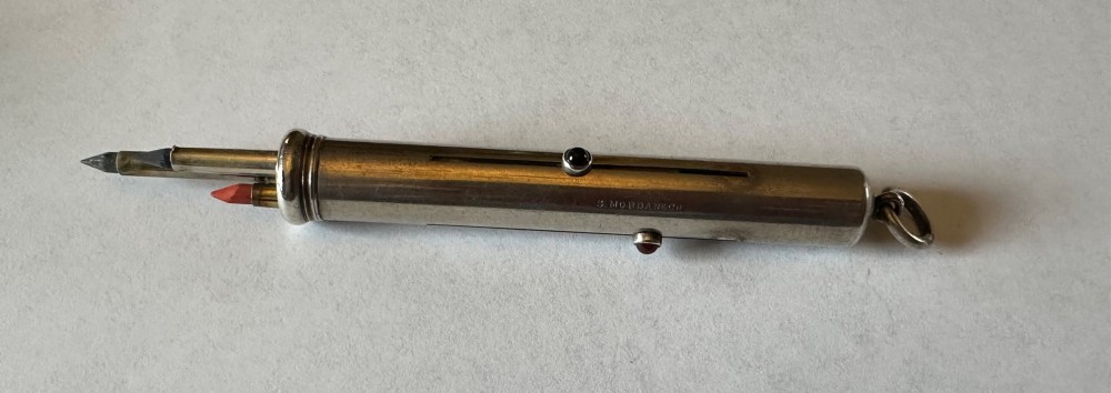 An antique Sampson Mordan sterling silver three-colour propelling pencil featuring side slider mechanisms and a top suspension ring. View VI