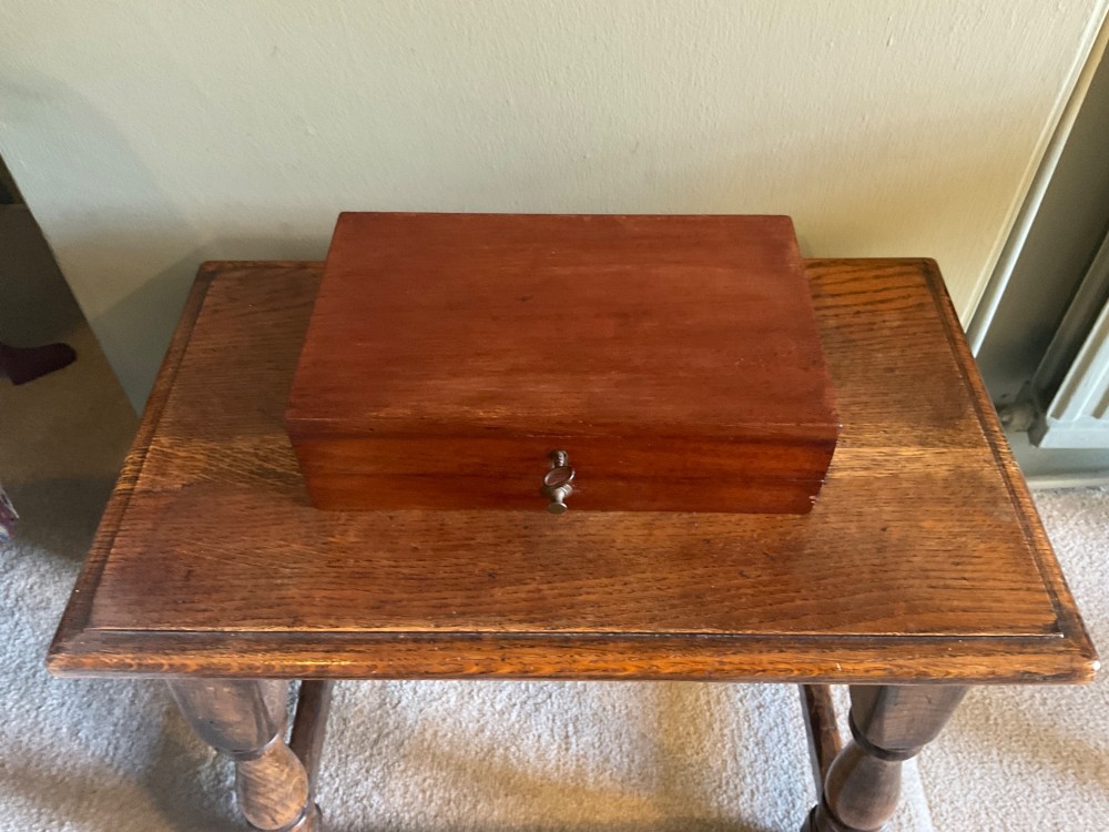 An open Victorian mahogany artist box featuring a gold-printed trade label inside the lid, fitted compartments containing watercolour blocks, and ceramic mixing dishes. View III
