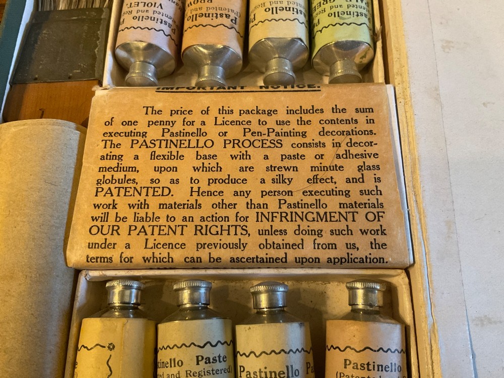 An open early 20th-century Workers Pastinello Outfit cardboard box containing paint tubes, a broad brush, and paper instructions. View III