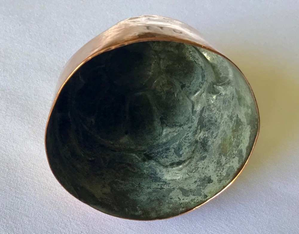 A small polished copper jelly mould featuring a two-tiered design with fluted vertical lobes on the upper section and a scalloped base. View III