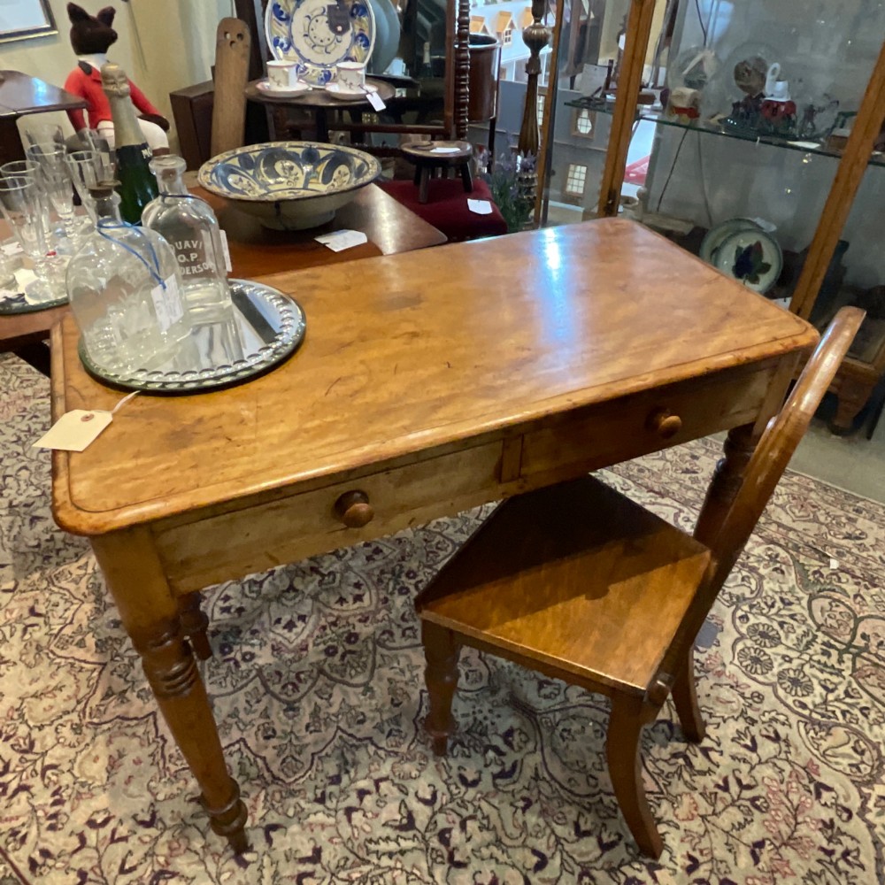 A Victorian satin walnut side table featuring two frieze drawers with wooden knob handles and four turned legs. View XI