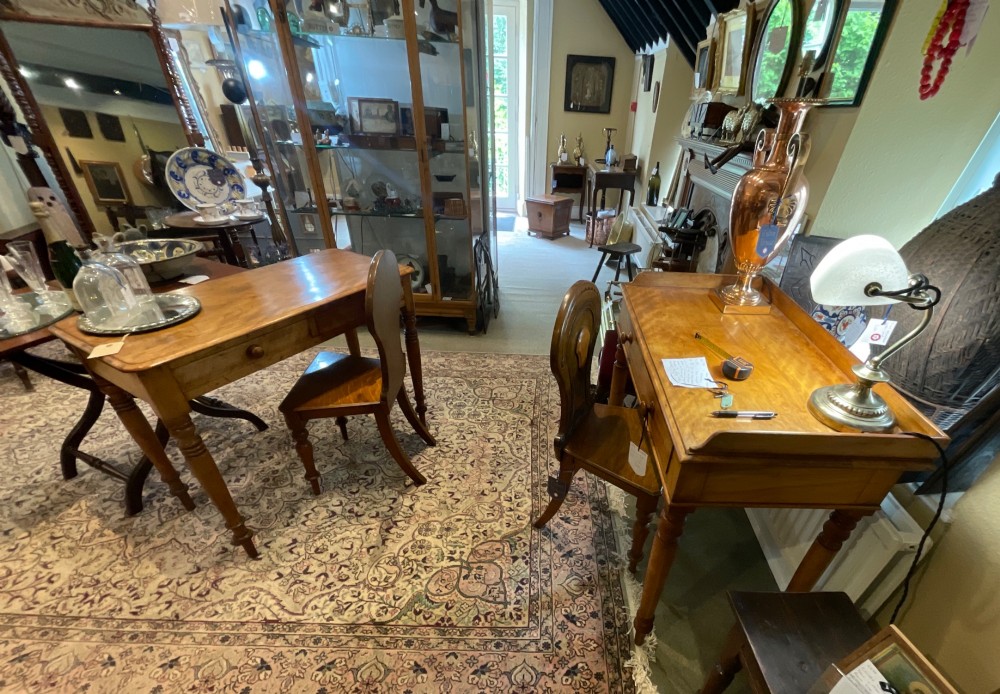 A Victorian satin birch writing desk featuring a three-quarter gallery top, two frieze drawers with turned wooden knobs, and four turned legs. View XII