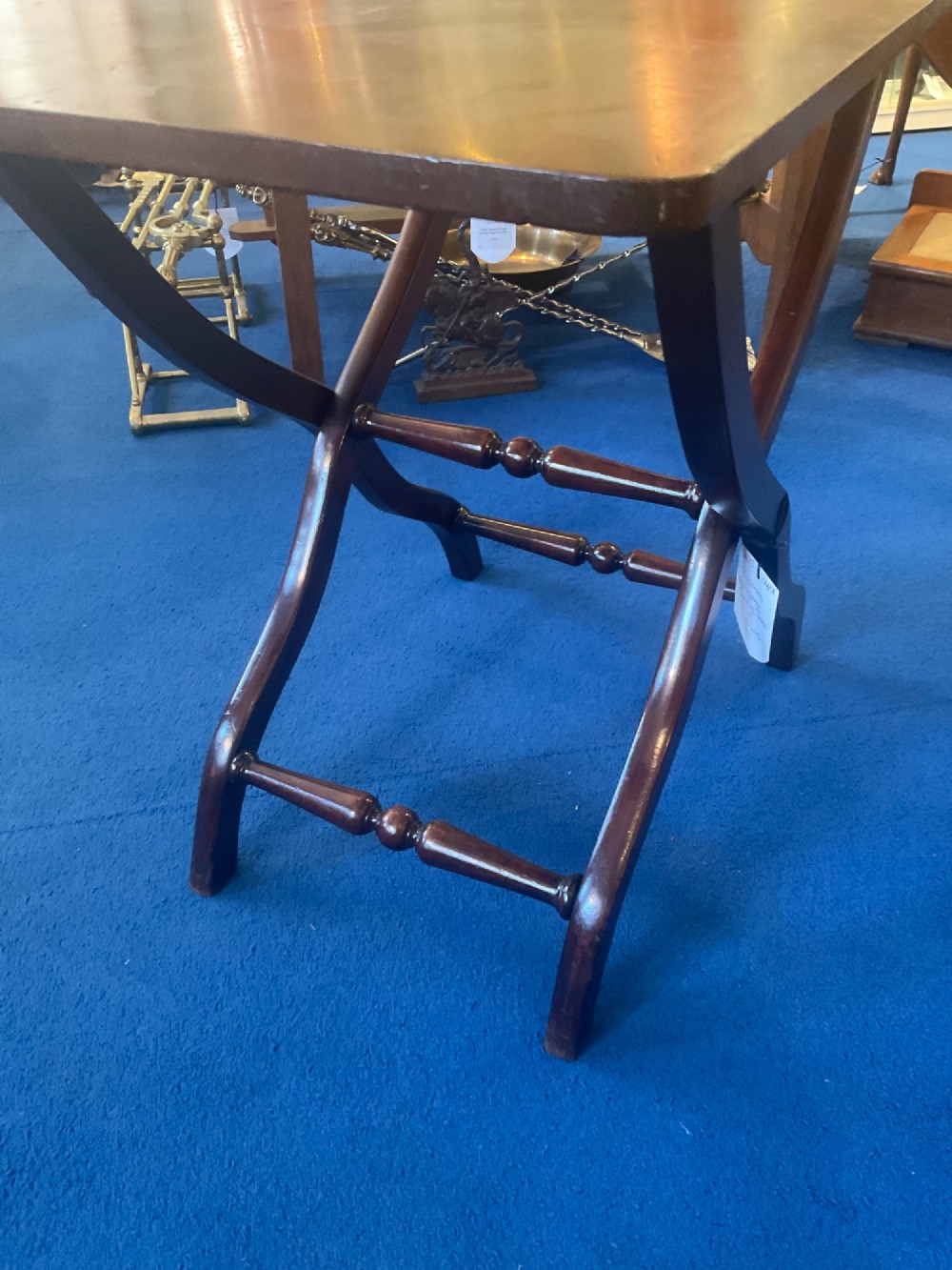 A Victorian mahogany coaching table featuring a hinged rectangular folding top supported by an X-frame base with turned stretchers. View V