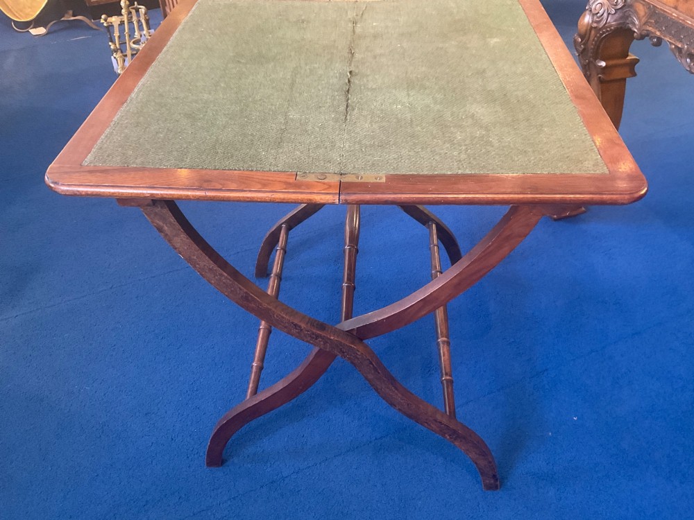 Victorian mahogany folding coaching table featuring a square green baize inset top and turned X-frame legs. View III
