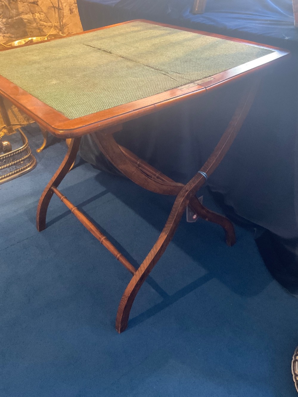Victorian mahogany folding coaching table featuring a square green baize inset top and turned X-frame legs. View IV