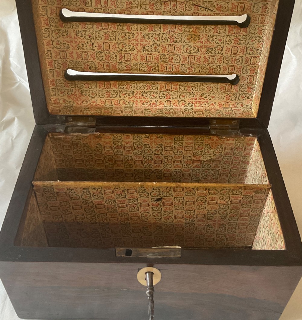 A dark mahogany 19th-century letter box featuring two top slots labelled Answered and Unanswered, a turned central knob, and a front keyhole with an inserted key. View V
