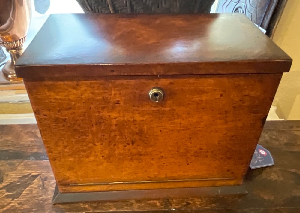 An open Victorian oak stationery box featuring internal tiered letter slots, two small drawers, a pen tray, a folding writing slope, and brass fittings. View II