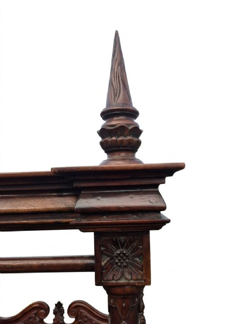 A dark mahogany four-poster bed frame featuring four spiral barley-twist posts topped with finials, a carved headboard, and claw-and-ball feet. View VII