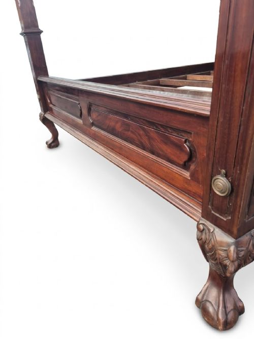 A dark mahogany four-poster bed frame featuring four spiral barley-twist posts topped with finials, a carved headboard, and claw-and-ball feet. View VIII