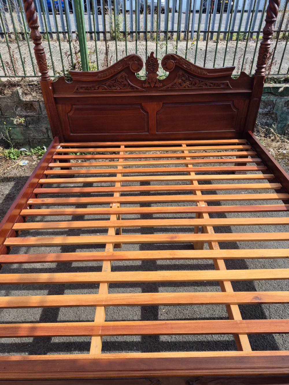A super king size four-poster bed frame crafted from dark carved wood featuring spiral twisted posts and a scrolled headboard crest. View III