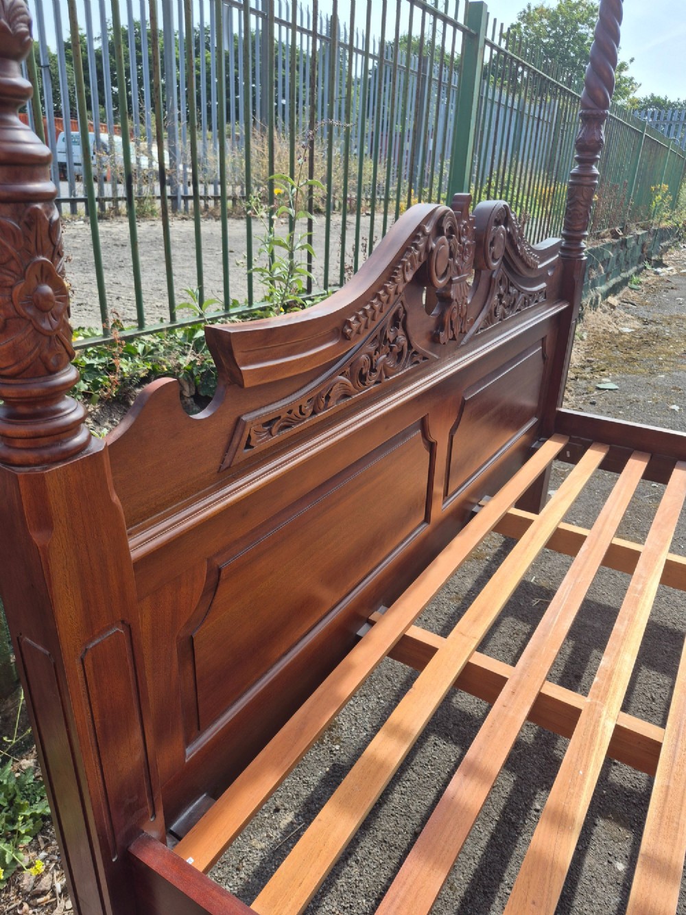 A super king size four-poster bed frame crafted from dark carved wood featuring spiral twisted posts and a scrolled headboard crest. View VII