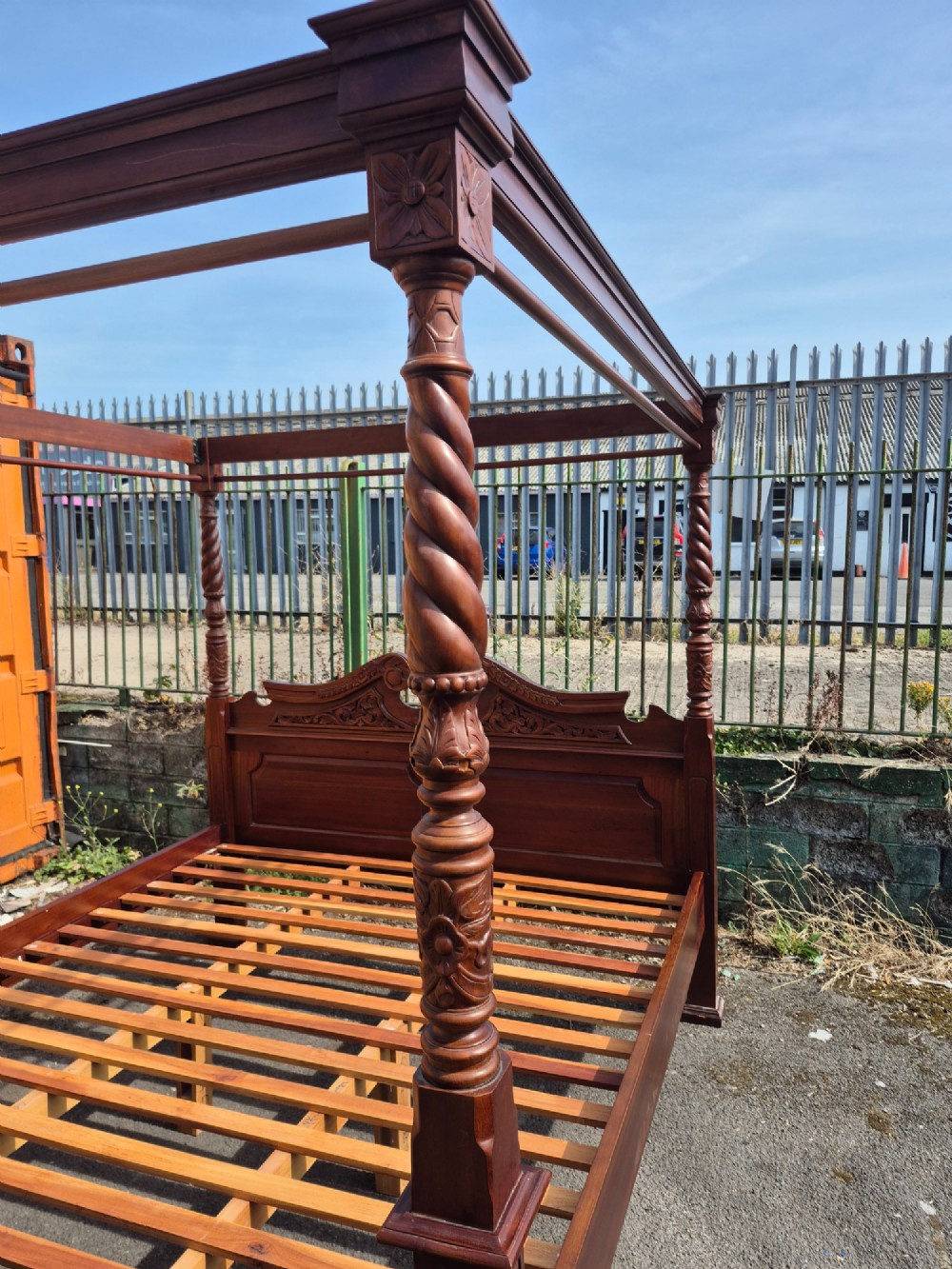 A super king size four-poster bed frame crafted from dark carved wood featuring spiral twisted posts and a scrolled headboard crest. View IX