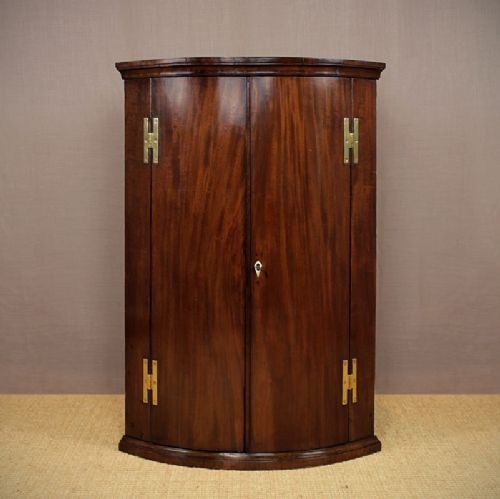 Bow Front Mahogany Corner Cupboard.