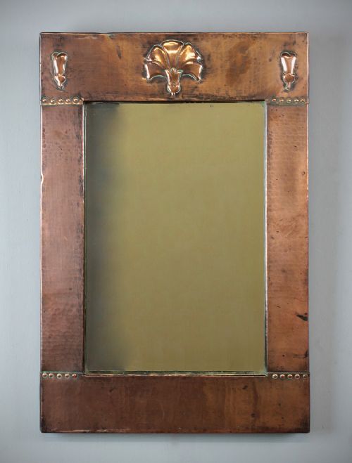 Repoussé Copper Mirror by Liberty & Co C.1900.