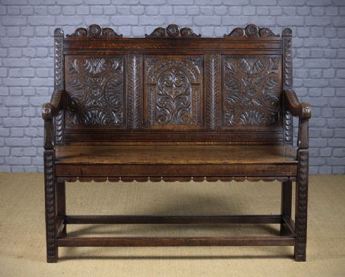 Carved Oak Settle C.1890.