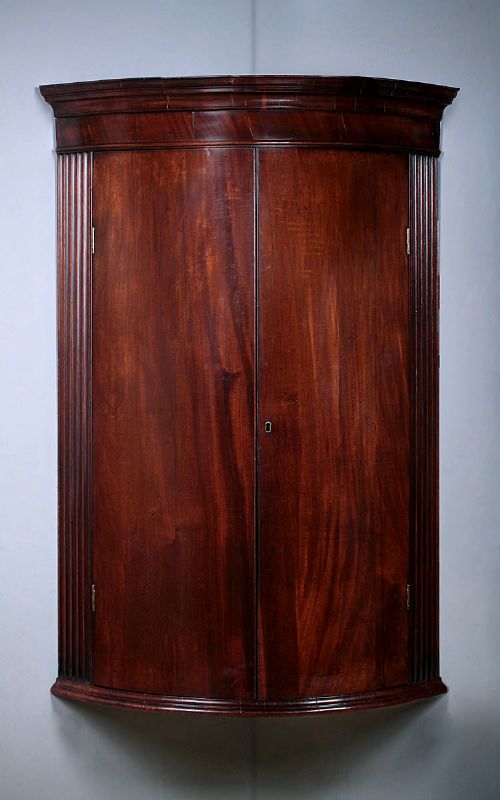 George III Mahogany Bow Front Corner Cupboard C.1810.