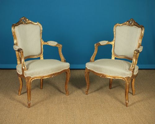 Pair of Louis Xv Style Giltwood Open Armchairs C.1900.