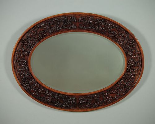 Oval Carved Oak Wall Mirror C.1910.