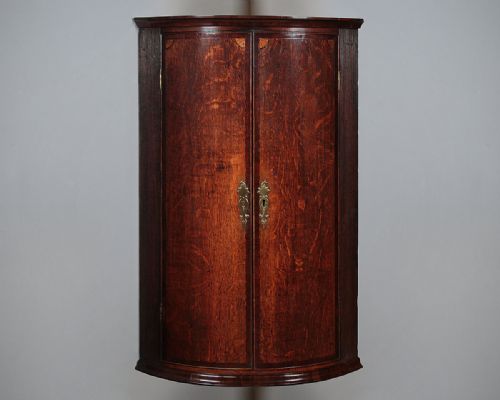 Georgian Oak Bow Front Corner Cupboard C.1790.