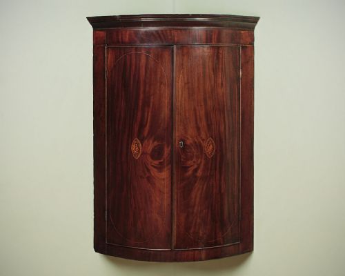 George III Inlaid Bow Front Corner Cupboard C.1810.