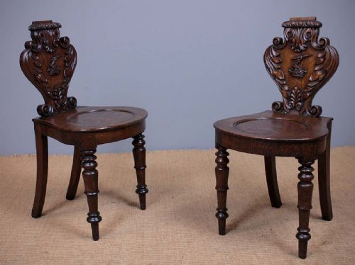 Pair of Oak Hall Chairs with Heraldic Carving C.1830.