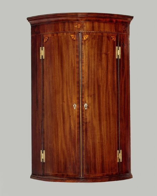 GEORGE III INLAID MAHOGANY BOW FRONT CORNER CUPBOARD C1810