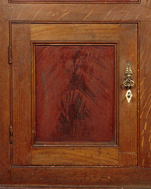 An antique 19th-century painted pine dresser base with central drawers, two side cupboard doors, red painted accent panels, and brass handles. View VIII