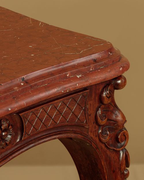 A late nineteenth-century carved walnut centre table with cabriole legs, Rococo frieze carving, and a rouge marble top. View VII