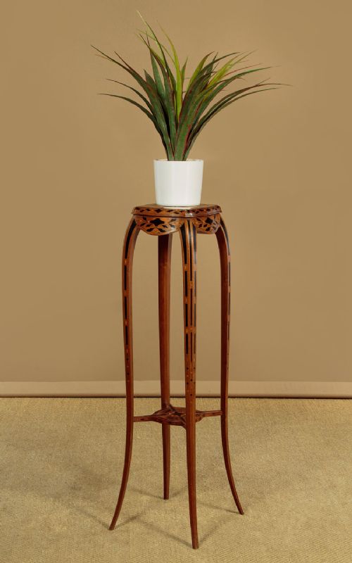 A tall, slender Edwardian specimen wood plant stand featuring geometric marquetry inlay on the top, apron, and legs, supported by four gently sweeping legs joined by an inlaid cross-stretcher. View II