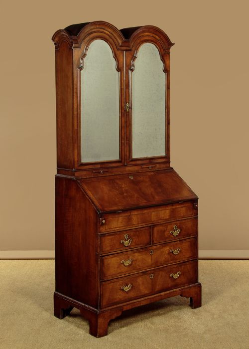 A Queen Anne style burr walnut bureau cabinet featuring a double-domed top with twin mirrored doors above a slant-front writing slope and lower drawers. View II